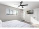 Bright bedroom with a bed, TV, and ceiling fan at 331 E Pierce St, Tempe, AZ 85288