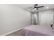 Bedroom with a queen bed, ceiling fan, and double doors at 331 E Pierce St, Tempe, AZ 85288