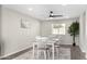 Simple dining room with a white table and chairs, and a gray rug at 331 E Pierce St, Tempe, AZ 85288