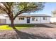 Charming single-story home with a well-manicured lawn and a gray driveway at 331 E Pierce St, Tempe, AZ 85288