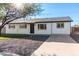 White single story home with a landscaped lawn and a gray driveway at 331 E Pierce St, Tempe, AZ 85288