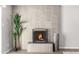 Modern fireplace with a gray tile surround and black metal screen at 331 E Pierce St, Tempe, AZ 85288