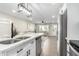Modern kitchen features white cabinets, quartz countertops, and stainless steel appliances at 331 E Pierce St, Tempe, AZ 85288