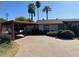 Home with carport and landscaping at 4461 E Flower St, Phoenix, AZ 85018