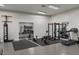 Home gym with a treadmill, weights, and punching bag at 5600 N 69Th Pl, Paradise Valley, AZ 85253