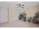 Spacious bedroom featuring double door closets and ceiling fan at 5677 S 239Th Dr, Buckeye, AZ 85326