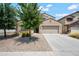 Two-story house with a large driveway and landscaping at 5677 S 239Th Dr, Buckeye, AZ 85326