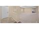 Hallway with carpet and access to living room at 5677 S 239Th Dr, Buckeye, AZ 85326
