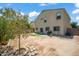 Two-story house exterior with a well-maintained yard and landscaping at 5677 S 239Th Dr, Buckeye, AZ 85326