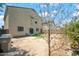 Two-story house exterior showcasing a backyard with a large tree at 5677 S 239Th Dr, Buckeye, AZ 85326