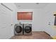 Laundry room with a washer and dryer, and cabinets at 5677 S 239Th Dr, Buckeye, AZ 85326
