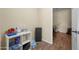 Bright laundry room with washer, dryer and built-in shelving at 5677 S 239Th Dr, Buckeye, AZ 85326