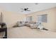 Living area with sectional sofa and neutral decor at 5677 S 239Th Dr, Buckeye, AZ 85326