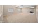 Living room with high ceilings and neutral decor at 5677 S 239Th Dr, Buckeye, AZ 85326