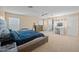 Main bedroom with ensuite bathroom and neutral decor at 5677 S 239Th Dr, Buckeye, AZ 85326