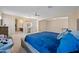 Main bedroom suite with large bed, ensuite bathroom access, and sitting area at 5677 S 239Th Dr, Buckeye, AZ 85326