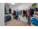 Large walk-in closet with ample shelving and hanging space at 5677 S 239Th Dr, Buckeye, AZ 85326