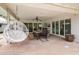 Covered patio with dining area and hanging chair at 5741 N 38Th Pl, Paradise Valley, AZ 85253