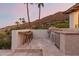 Outdoor kitchen with grill, bar seating and mountain views at 5942 E Sage Dr, Paradise Valley, AZ 85253