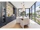 Modern dining room features a statement wall and large windows at 6040 E Lafayette Blvd, Scottsdale, AZ 85251