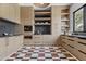 Well-equipped kitchen with light wood cabinets and marble floors at 6040 E Lafayette Blvd, Scottsdale, AZ 85251