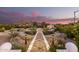 Landscaped garden with fountain and mountain view at sunset at 6742 N 48Th St, Paradise Valley, AZ 85253