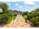 Landscaped gardens with brick pathway leading to fountain at 6742 N 48Th St, Paradise Valley, AZ 85253