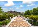 Brick pathway leading to a fountain with stunning mountain views at 6742 N 48Th St, Paradise Valley, AZ 85253