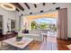 Living area with sliding glass doors opening to a patio and pool at 6742 N 48Th St, Paradise Valley, AZ 85253