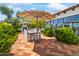 Outdoor patio with seating, umbrella, and built-in grill at 6742 N 48Th St, Paradise Valley, AZ 85253