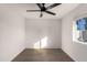 Simple bedroom with wood-look floors and ceiling fan at 6801 S Palm Dr, Tempe, AZ 85283