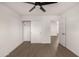 Bedroom with wood-look floors, ceiling fan and double closets at 6801 S Palm Dr, Tempe, AZ 85283