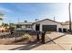 Ranch style home with a landscaped front yard at 6801 S Palm Dr, Tempe, AZ 85283