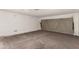 Clean, empty garage with large roll-up door and concrete floor at 6801 S Palm Dr, Tempe, AZ 85283