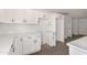White shaker cabinets in this galley kitchen at 6801 S Palm Dr, Tempe, AZ 85283