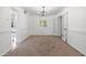 Simple dining room with wainscoting, chandelier, and neutral color palette at 700 W Northern Ave, Phoenix, AZ 85021