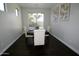 Bright dining room with dark hardwood floors and a chandelier at 7146 W Globe Ave, Phoenix, AZ 85043