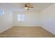 Well-lit bedroom featuring wood-look floors at 7519 S 13Th Pl, Phoenix, AZ 85042