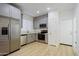 Modern kitchen with stainless steel appliances and light gray cabinets at 7519 S 13Th Pl, Phoenix, AZ 85042