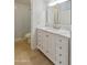 Modern bathroom with white shaker cabinets and marble countertop at 9084 E Winchcomb Dr, Scottsdale, AZ 85260