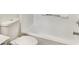 Clean bathroom with a bathtub and white tile at 10221 E Knowles Ave, Mesa, AZ 85209