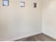 Bright bedroom with three small windows and carpet at 10221 E Knowles Ave, Mesa, AZ 85209