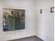 Well-lit bedroom with large window and carpet at 10221 E Knowles Ave, Mesa, AZ 85209