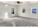 Bright bedroom with carpet, ceiling fan, and multiple windows at 10221 E Knowles Ave, Mesa, AZ 85209