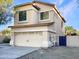 Two-story house with attached garage, showcasing side view at 10221 E Knowles Ave, Mesa, AZ 85209