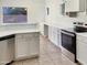 Modern kitchen with white cabinets and stainless steel appliances at 10221 E Knowles Ave, Mesa, AZ 85209