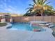 Relaxing pool area with a waterfall feature and fire pit at 10221 E Knowles Ave, Mesa, AZ 85209