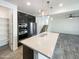 Kitchen island with sink and walk-in pantry at 10820 W Fillmore St, Avondale, AZ 85323