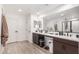 Modern bathroom with double vanity and dark brown cabinets at 11311 E Upton Ave, Mesa, AZ 85212
