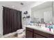 Clean bathroom with shower/tub and dark vanity at 11311 E Upton Ave, Mesa, AZ 85212